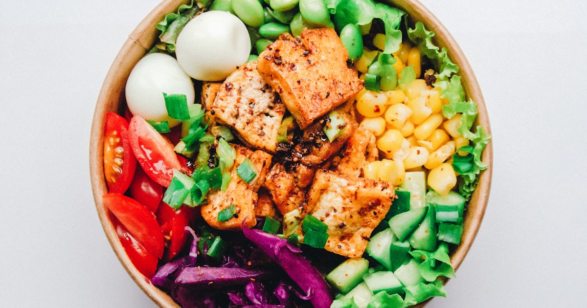 Colorful meal prep bowls with fresh, healthy ingredients