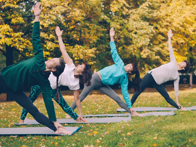 Group of women exercising outdoors in a park